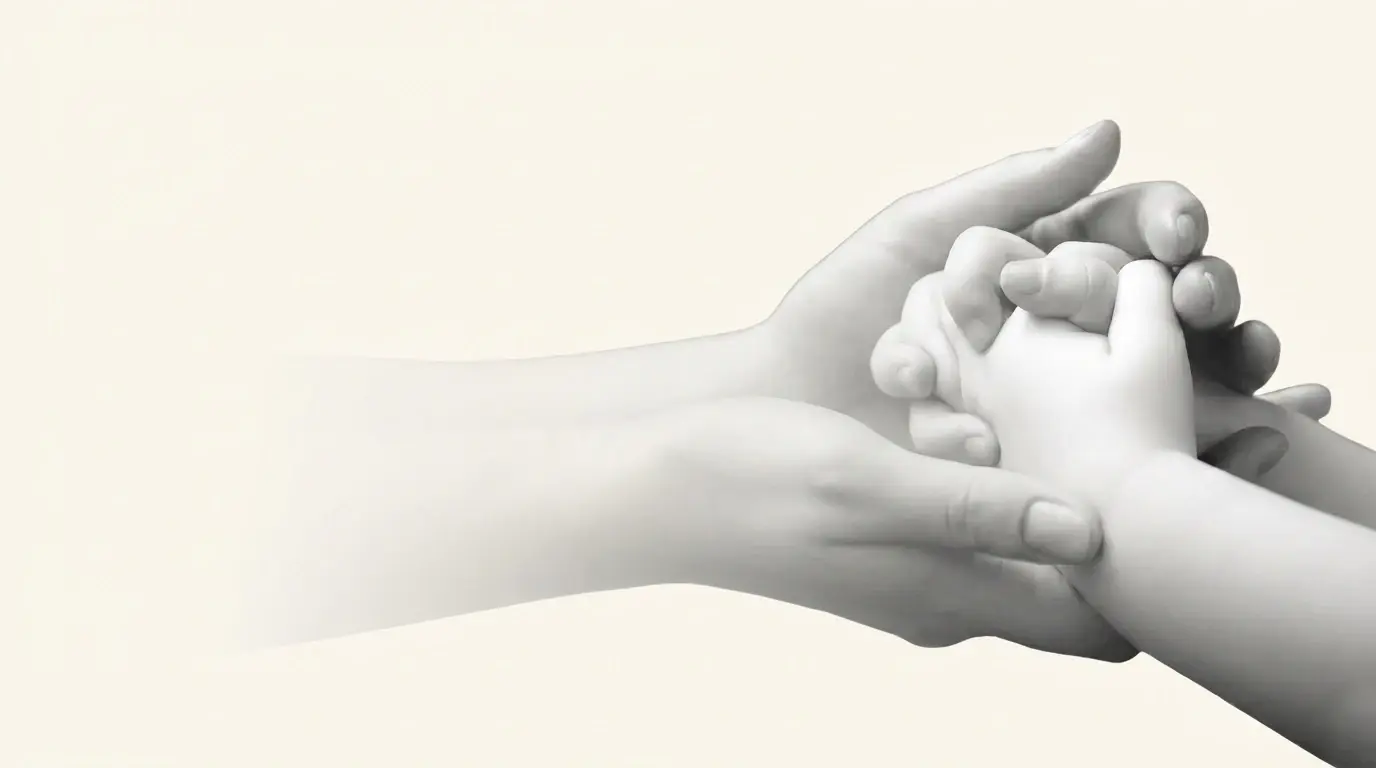 An adult's hands gently cradling a child's clasped hands